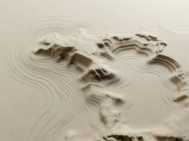 Soft-lit 3D topographic model showing headland bathymetry curving swell lines into a calm bay on a plain cream surface